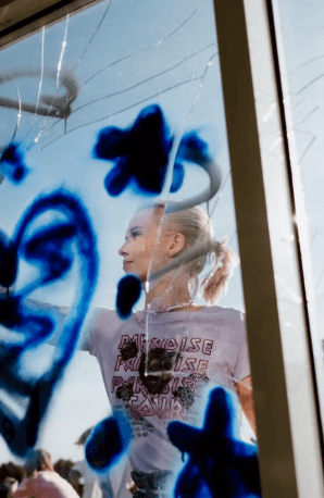 Rahway High School Students Paint UCPAC Windows for Breast Cancer Awareness Month